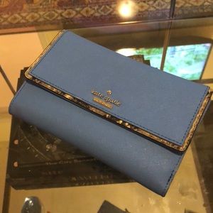 Blue Kate Spade wallet with snake trim